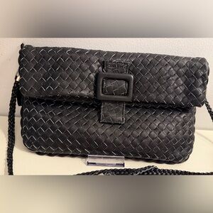 Itsera soft black woven leather crossbody bag in new without tags condition.